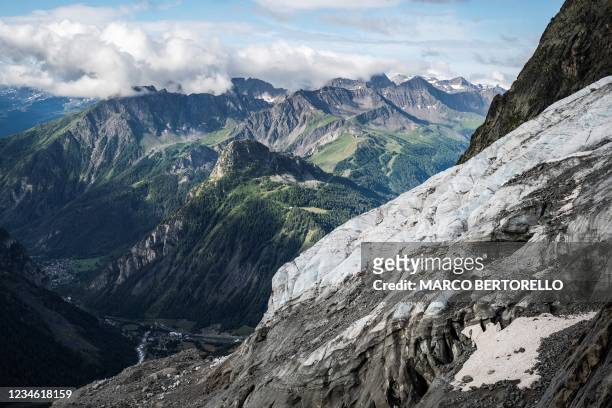 This general view shows The Planpincieux Glacier from the side in Courmayeur, Alps Region, north-western Italy, on August 5, 2021. - A melting...
