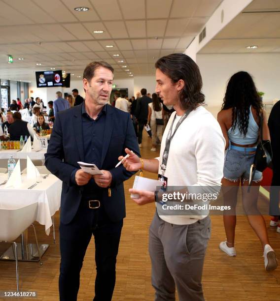 Franco Foda talking with one press member during the Pre-Season Friendly Match between Real Madrid and AC Milan at Worthersee Stadion on August 8,...