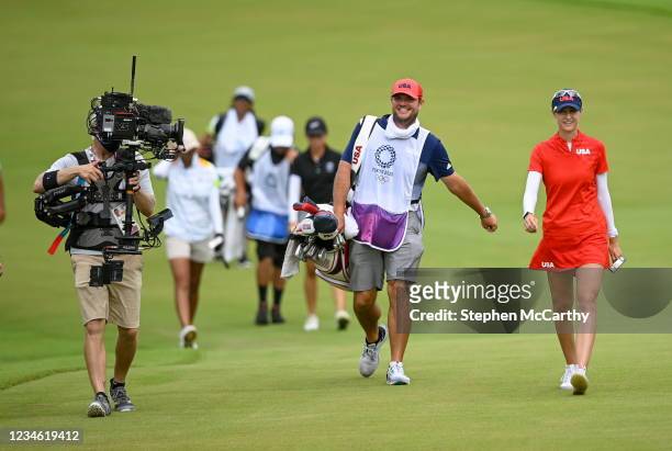 Saitama , Japan - 7 August 2021; Nelly Korda of United States and caddy Jason McDede on the 18th during round four of the women's individual stroke...