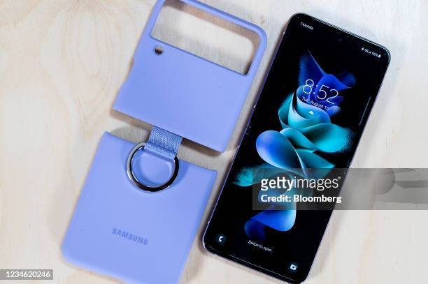 Samsung Electronics Co. Galaxy Z Flip3 5G Z Flip 3 foldable smartphone and silicon cover at the Samsung Unpacked product launch event in New York,...