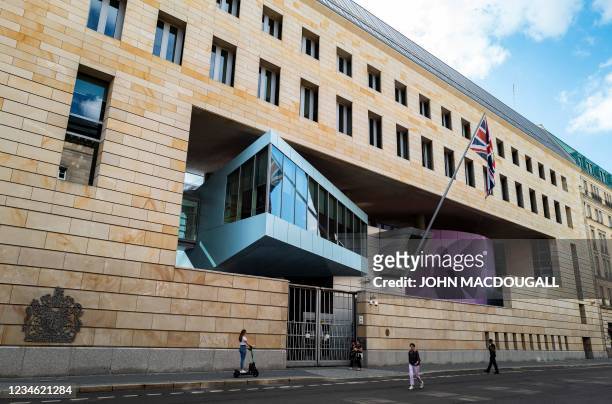 Pedestrians pass in front of the British Embassy in Berlin on August 11, 2021. - A British man suspected of spying for Russia in exchange for cash...
