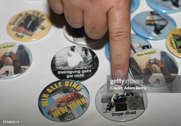 Vendor sells anti-fundamentalist Islam buttons, including one of a Lego figurine dressed as a suicide bomber, at a German Die Freiheit party rally on...