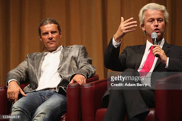Dutch right-wing politician Geert Wilder speaks as Oskar Freysinger of the Swiss People's Party listens at a German Die Freiheit press conference at...