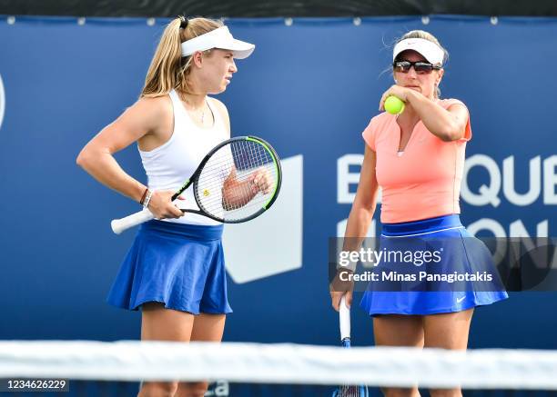 Ellen Perez of Australia and Kveta Peschke of the Czech Republic talk over their strategy during their Women's Doubles match against Jelena Ostapenko...