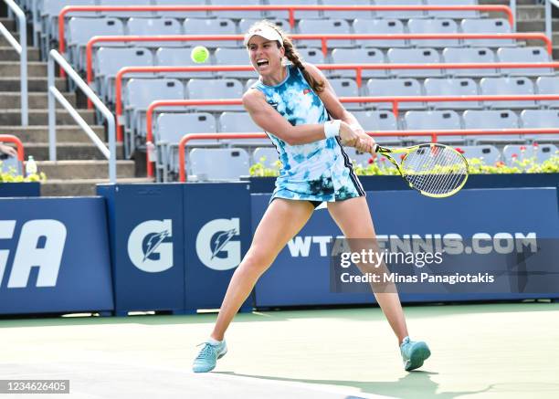 Johanna Konta of Great Britain hits a return during her Women's Singles second round match against Elina Svitolina of Ukraine on Day Three of the...