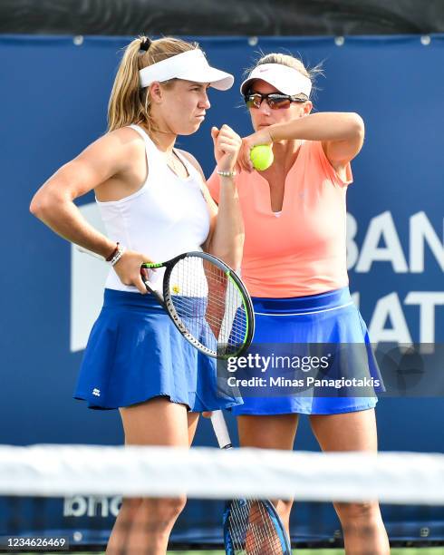 Ellen Perez of Australia and Kveta Peschke of the Czech Republic talk over their strategy during their Women's Doubles match against Jelena Ostapenko...