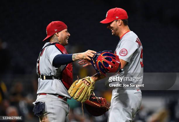 Adam Wainwright of the St. Louis Cardinals celebrates with Yadier Molina after pitching a complete game and defeating the Pittsburgh Pirates 4-0 at...