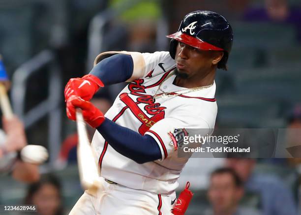 Ozzie Albies of the Atlanta Braves hits a walk off, three-run home run in the eleventh inning of an MLB game against the Cincinnati Reds at Truist...