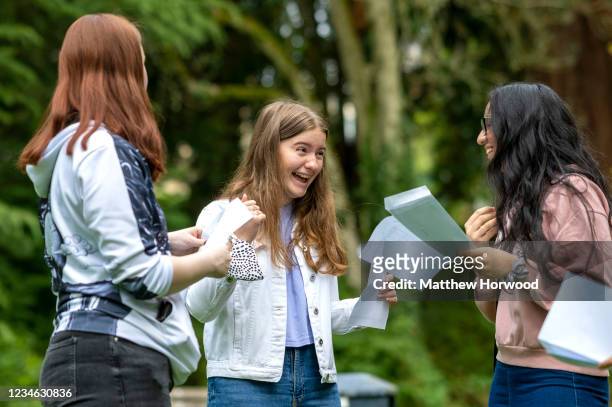 Sophie Thomas celebrates after opening her GCSE results at Ffynone House School on August 12, 2021 in Swansea, United Kingdom. Year 11 students are...