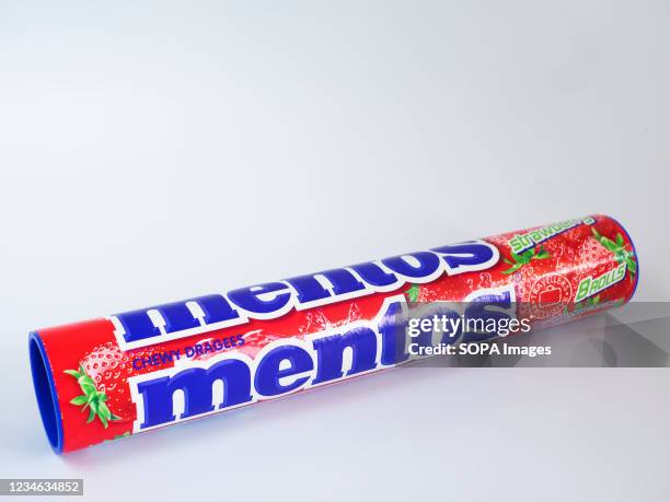 In this photo illustration a pack of Mentos, strawberry chewy dragees displayed on a white background.