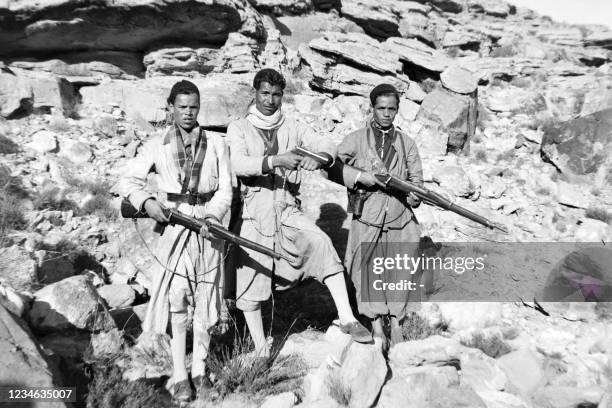 Algerian separatists of the National Liberation Army , pose with their weapons in the Algerian maquis, near the Tunisian border, in May 1955, during...