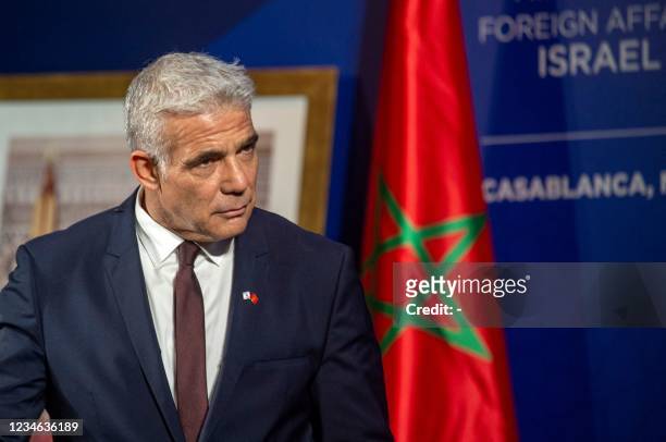Israeli alternate prime minister and Foreign Minister Yair Lapid gives a news conference in the Western Moroccan city of Casablanca, on August 12,...
