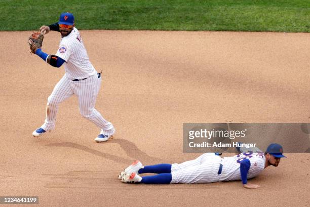 Jonathan Villar of the New York Mets throws over J.D. Davis of the New York Mets during the seventh inning against the Washington Nationals in game...