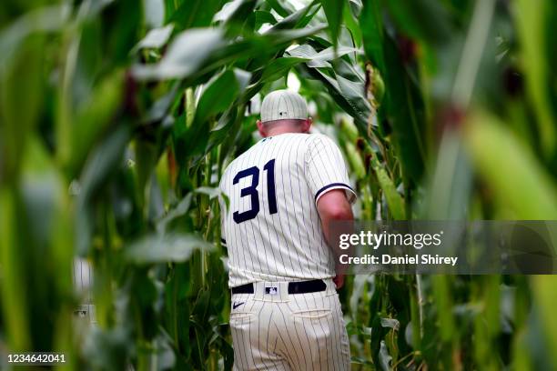 Liam Hendriks of the Chicago White Sox walks through the corn field during pre-game ceremony prior to the game between the New York Yankees and the...