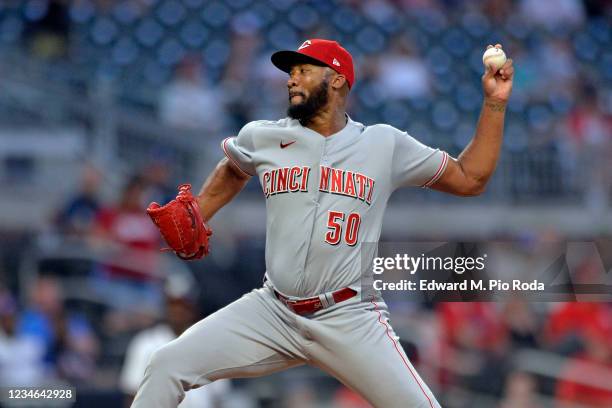 Amir Garrett of the Cincinnati Reds pitches in the ninth inning against the Atlanta Braves at Truist Park on August 12, 2021 in Atlanta, Georgia.
