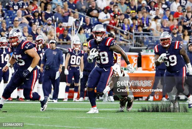 New England Patriots running back James White breaks into the secondary on a run during a preseason game between the New England Patriots and the...