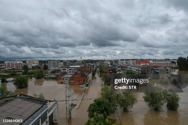 This overhead view taken on August 12, 2021 shows flooded streets following heavy rains in Suizhou in China's central Hubei province. - - China OUT /...