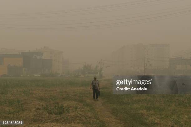 Blanket of smog covers the city as air pollution increases due to the ongoing wildfires around the village of Kharyyalakh in Sakha, Russia on August...