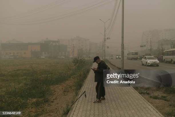 Blanket of smog covers the city as air pollution increases due to the ongoing wildfires around the village of Kharyyalakh in Sakha, Russia on August...