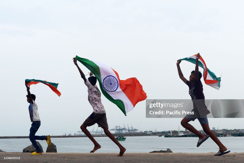 Children seen carrying Indian National Flag in a fishing...