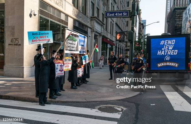 Protesters staged a rally on the steps of New York Public Library and marched to Ben & Jerry's store in Times Square to continue the rally against...