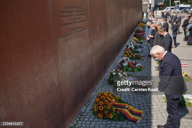 German President Frank-Walter Steinmeier lays a wreath at a memorial to victims of the Berlin Wall on the 60th anniversary of the construction of the...