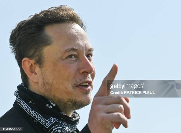 Entrepreneur and business magnate Elon Musk gestures during a visit at the Tesla Gigafactory plant under construction, on August 13, 2021 in...