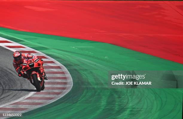 Ducati Italian rider Francesco Bagnaia steers his motorbike during the second free practice session ahead of the Austrian Motorcycle Grand Prix at...