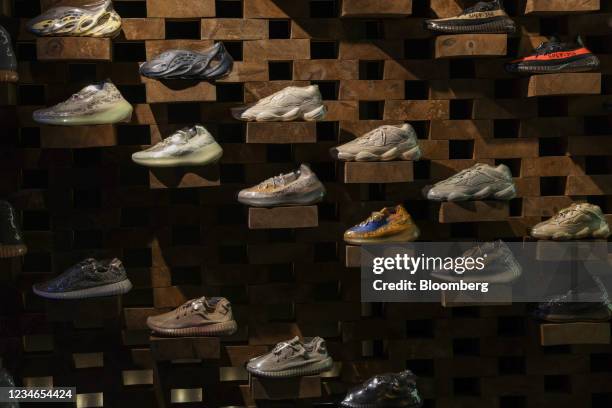 Shrink-wrapped limited edition Adidas AG 'Yeezy' model trainers inside the Presented By sneaker resale store in London, U.K., on Friday, Aug. 13,...