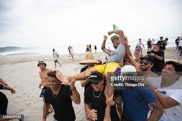 Champion Adriano De Souza of Brazil reacts after surfing his last wave celebration at the Corona Open Mexico presented by Quiksilver on August 13,...