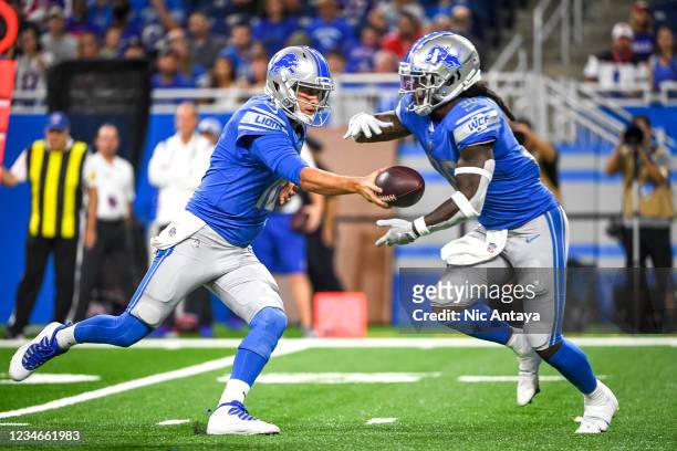 Jared Goff of the Detroit Lions hands the ball off to Jamaal Williams of the Detroit Lions during the first quarter of a preseason game at Ford Field...