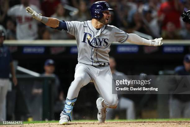 Kevin Kiermaier of the Tampa Bay Rays reacts after sliding at home to score on an inside-the-park home run against the Minnesota Twins in the sixth...