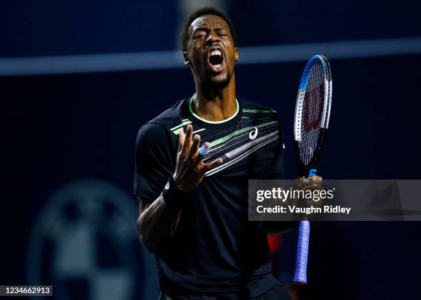 Gael Monfils of France reacts after losing a point against John Isner of the United States during a quarterfinal match on Day Five of the National...