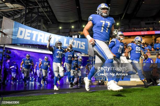 The Detroit Lions enter the field before a preseason game against the Buffalo Bills at Ford Field on August 13, 2021 in Detroit, Michigan.