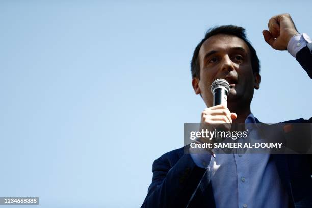 French nationalist party "Les Patriotes" party leader Florian Philippot addresses the audience during a national day of protest against the...