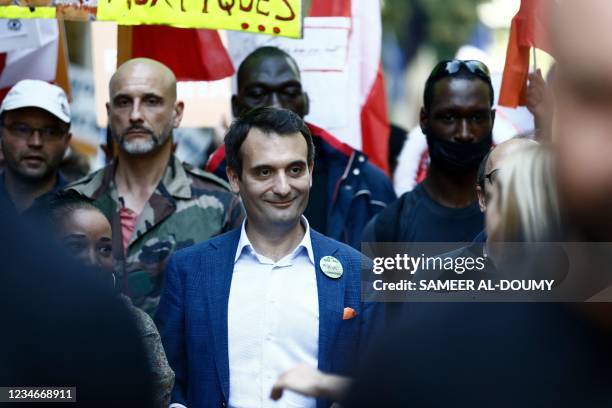 French nationalist party "Les Patriotes" party leader Florian Philippot demonstrates during a national day of protest against the compulsory Covid-19...