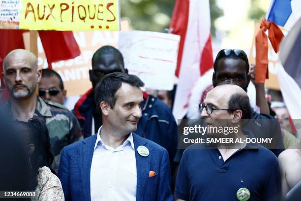 French nationalist party "Les Patriotes" party leader Florian Philippot demonstrates with lawyer for public health Fabrice di Vizio during a national...