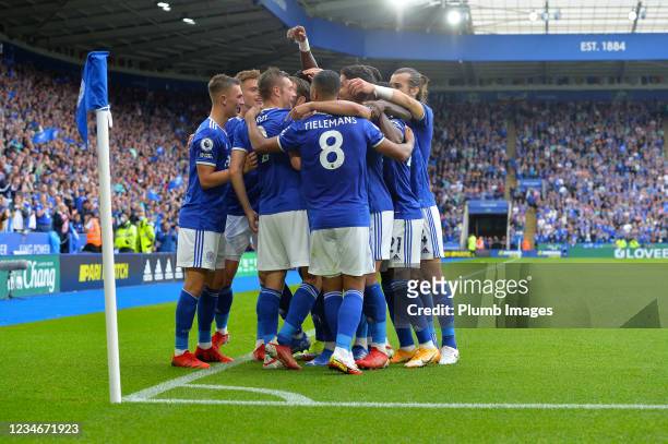 Jamie Vardy of Leicester City celebrates scoring the opening goal for Leicester City with team mates during the Premier League match between...