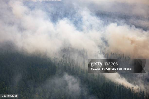 This aerial picture taken from an airplane on July 27, 2021 shows a burning forest at Gorny Ulus area, west of Yakutsk, in the republic of Sakha,...