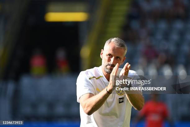 Dortmund's German head coach Marco Rose acknowledges the fans prior to the German first division Bundesliga football match between Borussia Dortmund...