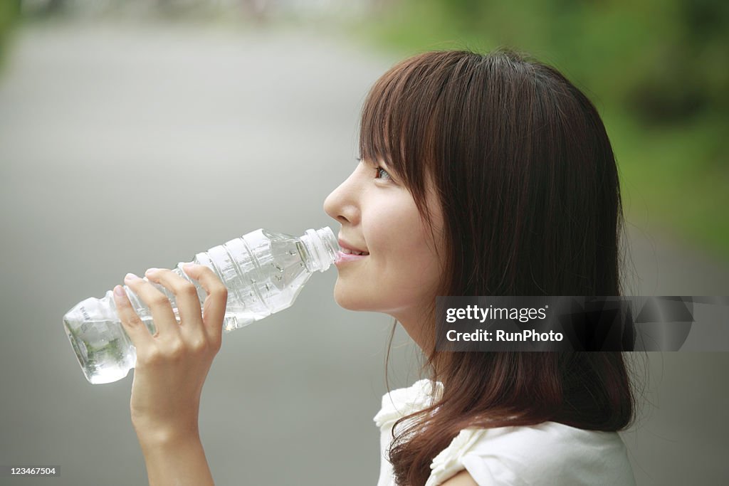 Young woman drinking water,healthy lifestyle