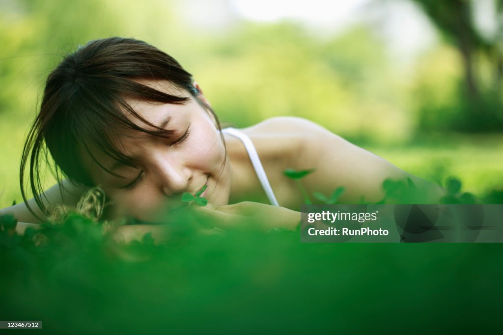 Young woman lying in the grass,healthy lifestyle