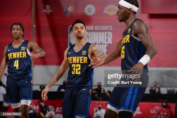 Jimmer Fredette of the Denver Nuggets high fives Zylan Cheatham of the Denver Nuggets during the 2021 Las Vegas Summer League on August 14, 2021 at...