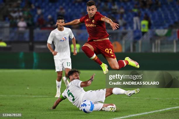 Roma's Italian forward Stephan El Shaarawy fights for the ball with Raja Club Athletics forward Mouhssine Moutouali during the Italian friendly...