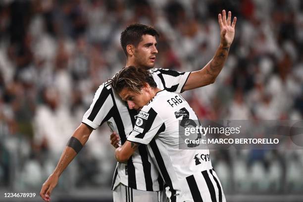 Juventus' Spanish forward Alvaro Morata celebrates after scoring a goal with Juventus' Italian midfielder Nicolo Fagioli during the friendly football...