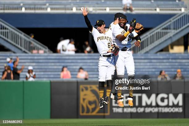 Hoy Park of the Pittsburgh Pirates celebrates with Gregory Polanco and Bryan Reynolds after the final out in a 14-4 win over the Milwaukee Brewers...