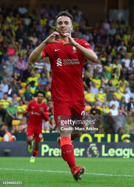 Diogo Jota of Liverpool celebrates scoring the opening goal during the Premier League match between Norwich City and Liverpool at Carrow Road on...