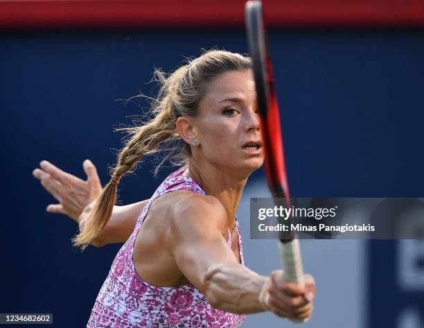 Camila Giorgi of Italy hits a return in the second set during her Women's Singles Semifinals match against Jessica Pegula of the United States on Day...