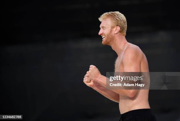 Chase Budinger reacts after a point during a match between Miles Evans and Ricardo Santos and Chase Budinger and Casey Patterson on day two of the...