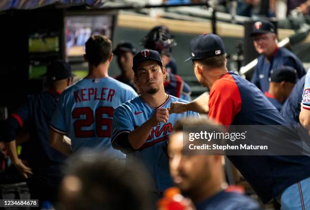 Kenta Maeda of the Minnesota Twins is congratulated in the dugout after pitching six scoreless innings in the game against the Tampa Bay Rays at...